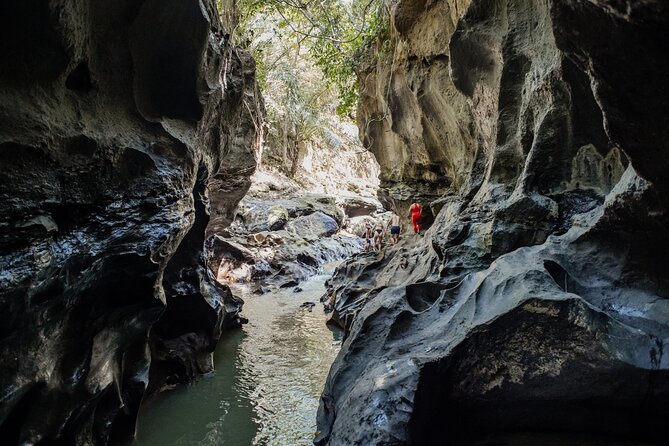 Bali Adventure Tour: Hidden Canyon, Tegenungan Waterfall, Goa Gajah temple - Gunung Kawi at Tampaksiring (Sebatu Temple area): old stone in a calm setting