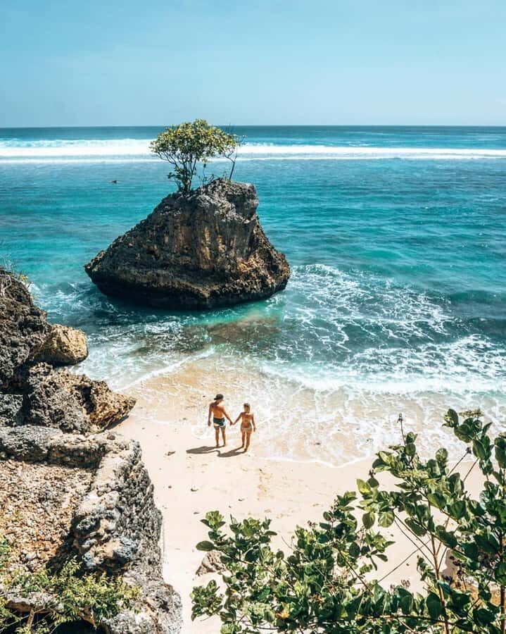 Bali: Beachfront Paradise & Sunset Journey with Dinner - Blue Point Beach: white sand, clear water, and rock shapes for great photos