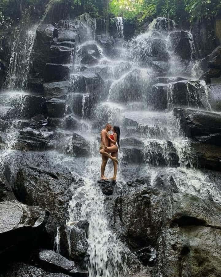 Bali: Best of Ubud Waterfalls Tour - Kanto Lampo Waterfall: iconic rock form and the stair descent