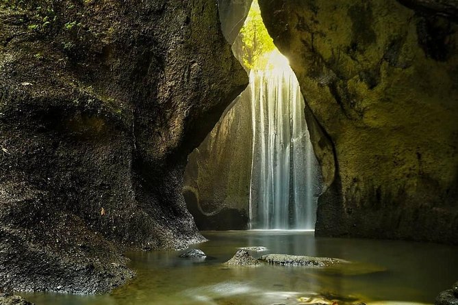 Bali Instagram Tour: Lempuyang Temple, Tirta Gangga and Tukad Cepung Waterfall - Tirta Gangga Water Palace: tiered fountains and royal-era stonework