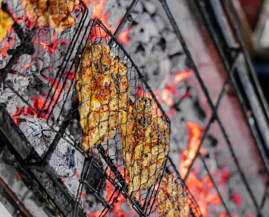 Bali: Jimbaran Seafood Market Tour with Sunset Dinner - From Market Seafood to Beach BBQ: The Coconut Husk Coals Detail