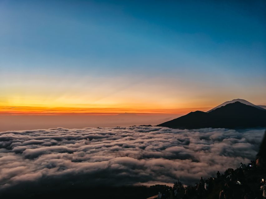 Bali: Mount Batur Guided Sunrise Trek with Breakfast - The Crater Lake and Volcanic Loop: lava fields, purple grass, and photos on the move