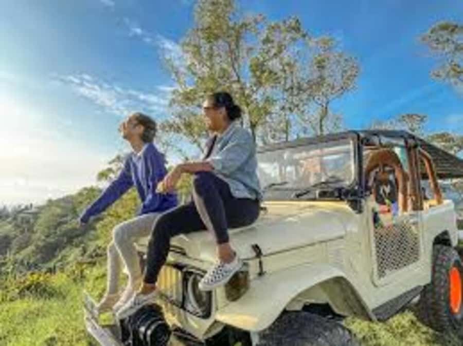 Bali: Mt Batur Jeep Sunrise & Taman Sari Waterfall Tour - After sunrise: volcanic scenery on the way down
