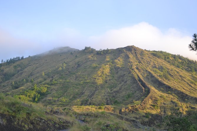 Batur Sunrise Trekking - Descending past black lava, farms, and possible monkey sightings