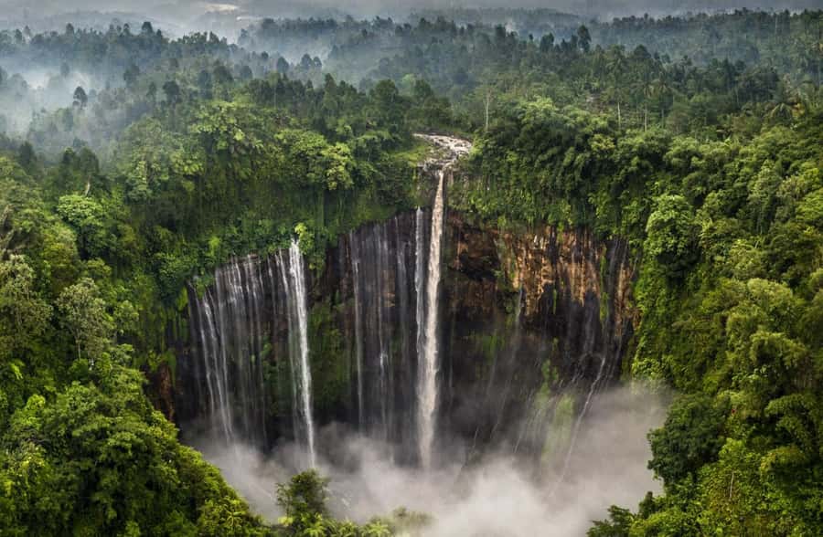 From Malang: Tumpak Sewu Waterfall Sharing Tour - At the base: 120 meters of multi-stream water in front of you