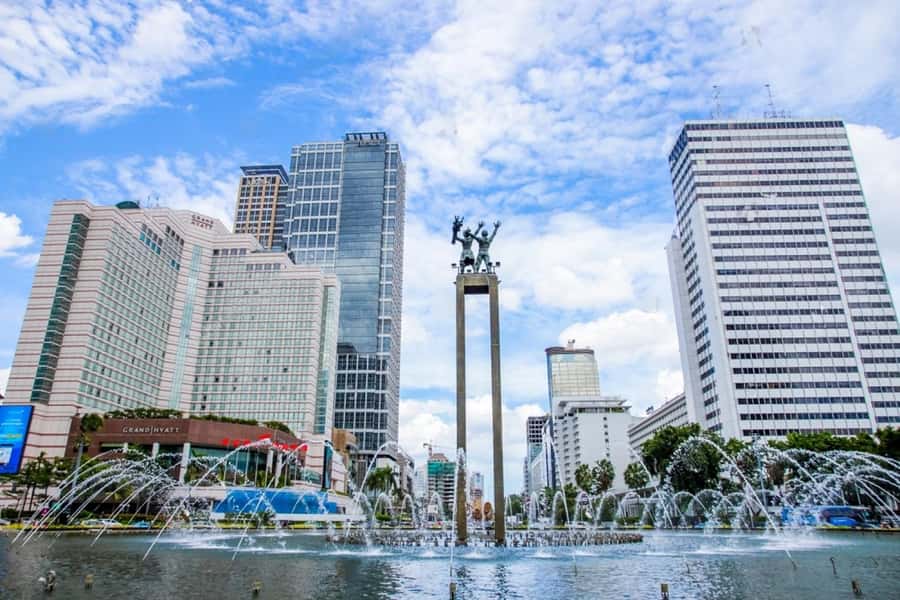 From the Airport: Welcome to the Highlights Tour of Jakarta - Sunda Kelapa Harbor: Portuguese and Dutch maritime links, plus Pinisi ships