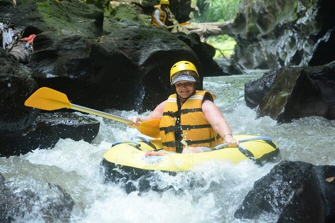 Full Day ATV Quad Bike and River Tubing Experience in Bali - The switch to river tubing: life jacket, helmet, paddle