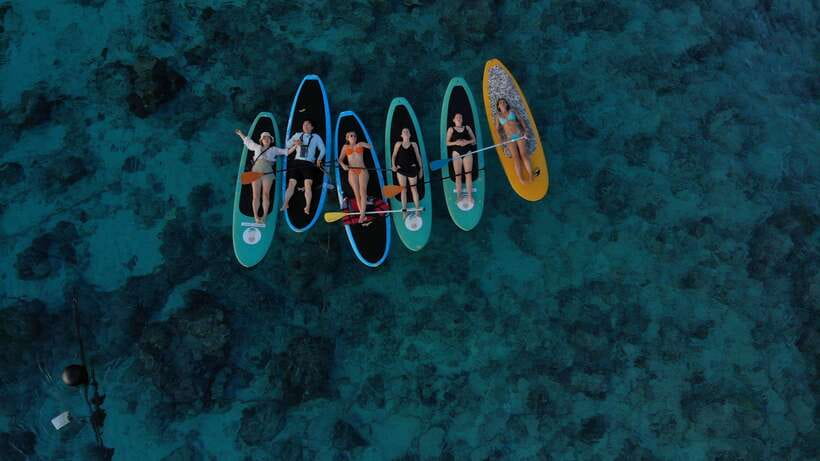 gili sunrise Stand-up paddle boarding or kayaking (droneshot - First taste of sunrise on SUP or kayak