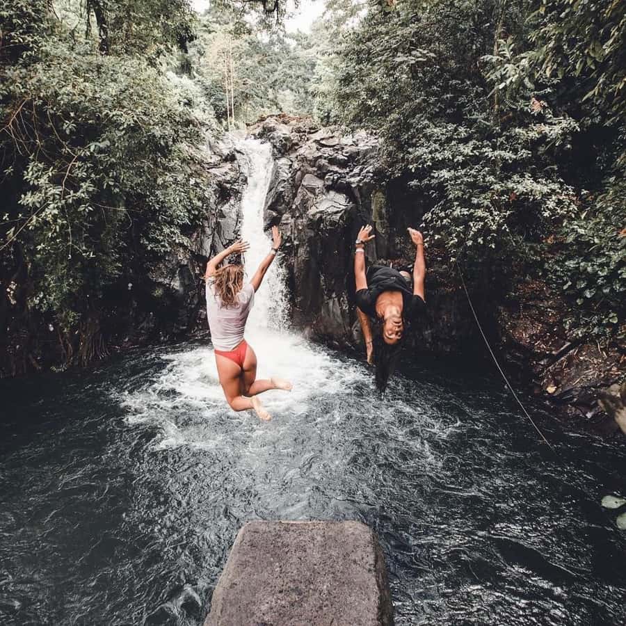 Jumping Sliding at Aling- Aling Waterfall and Handara Gate - Private, Air-Conditioned Transport and a Guide Who Keeps You Moving