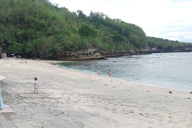 Nusa Penida East And West Full Day Private Guided Tour - Stop 2: Atuh Beach (cliffs, clear water, and high-angle shots)