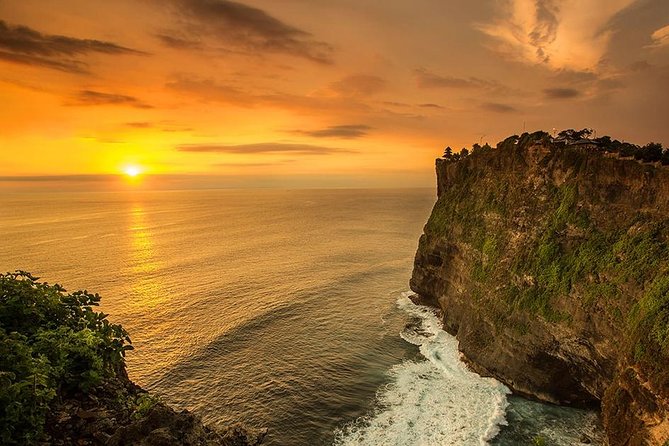 Private Tour Bali Beaches and Uluwatu Temple with Dinner - Padang Padang Beach: Rock Walk-In, Movie Fame, and Surf Energy
