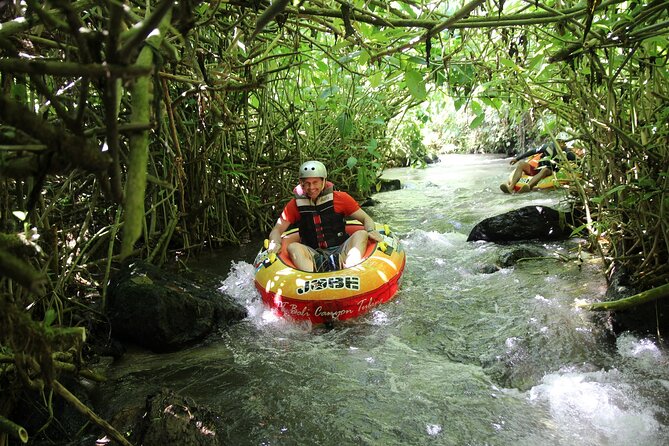 Quad or Buggy Tour with Canyon Tubing Adventure in Bali - The Canyon Approach: Wooden Paths, Waterfalls, and Suspension Bridges