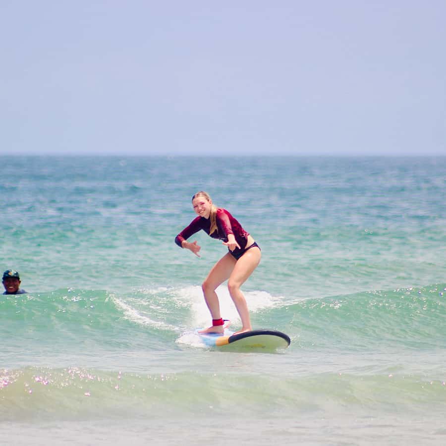 Surfing Class for Beginners Legian Beach Bali - Malu Surf setup: equipment, rash guard top, and getting kitted fast