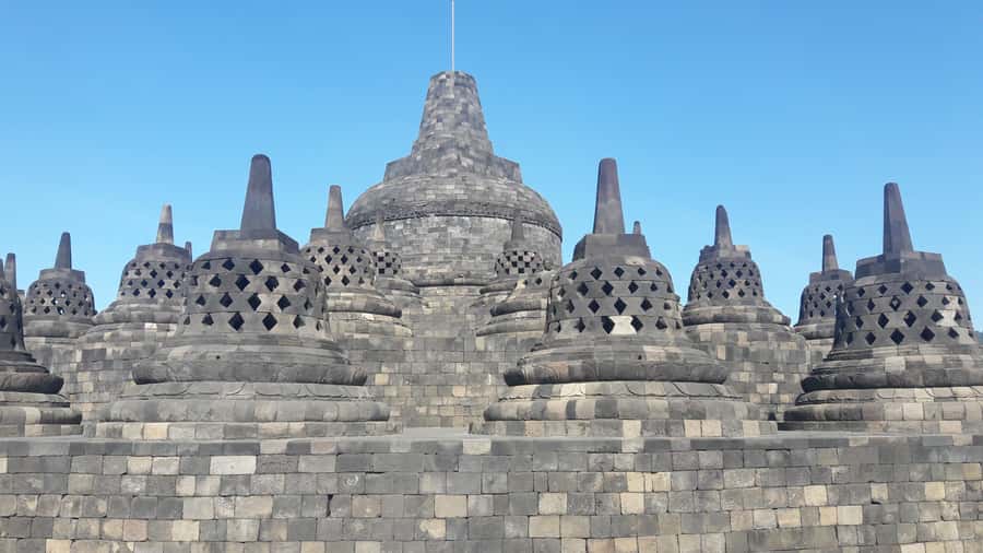 Yogyakarta: Borobudur and Prambanan Private Tour - Borobudur Temple climb: 100+ steps and the 72-stupa layout