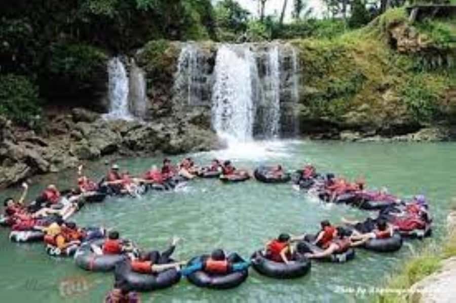 Yogyakarta: Jomblang and Pindul Cave Guided Day Trip - Pindul Cave: donut boat floating through an ultramarine underground river