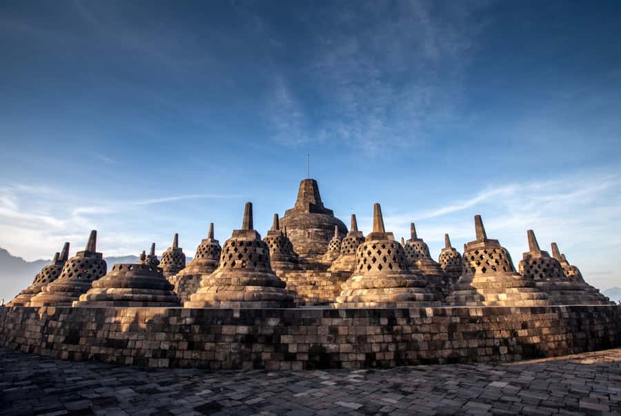 Yogyakarta: Setumbu Sunrise, Borobudur & Prambanan Day Tour - The sunrise view: fog lift, rice terraces, and the volcano silhouette